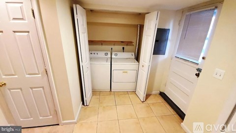 A bedroom with a bed, dresser, and closet.