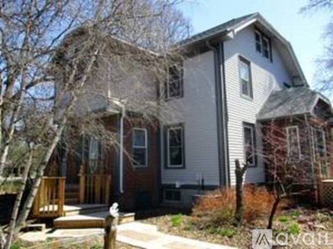 A two-story house with a front porch.