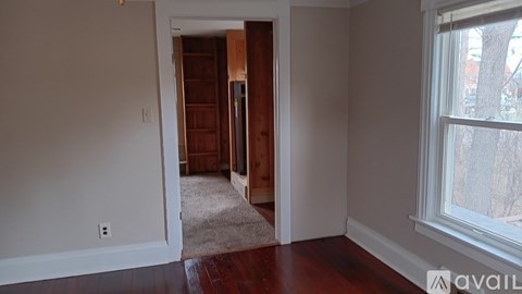 A room with a doorway leading to another room.