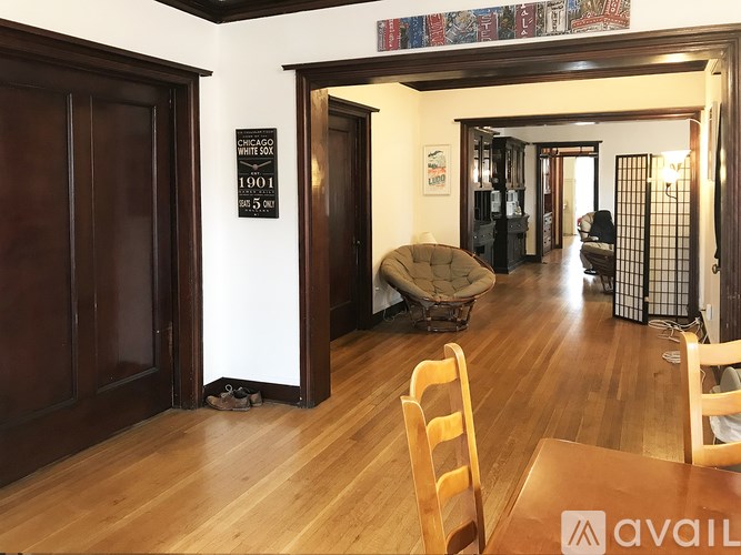 A room with wooden floors and a sign that says "White Sox 1901 5201".