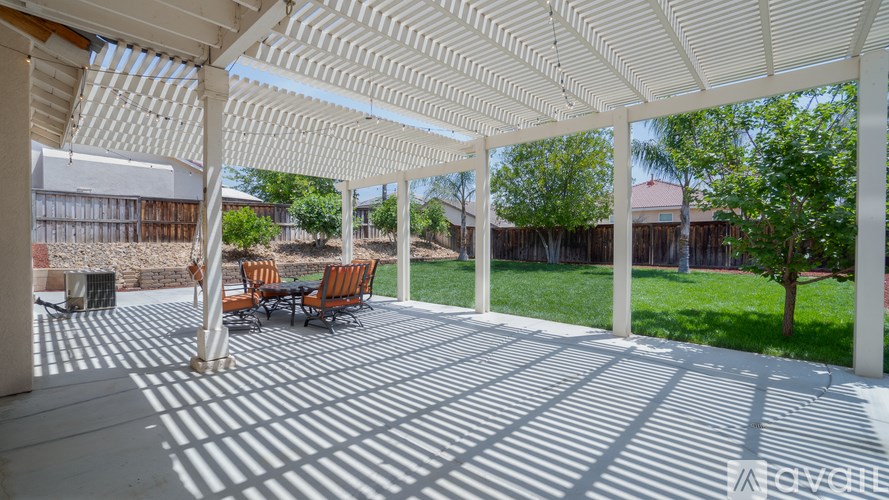A white patio with a white roof and a white floor.