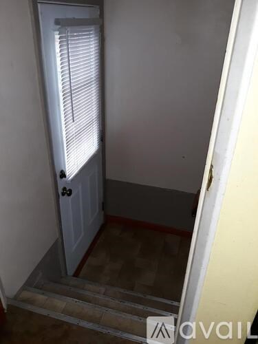 A white door with a window above it.