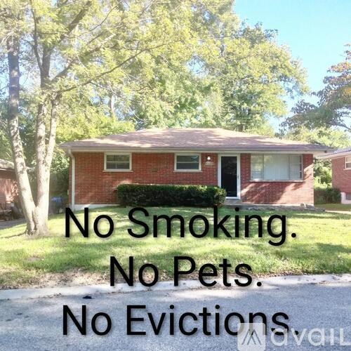 A house with a sign stating "No Smoking. No Pets. No Evictions."