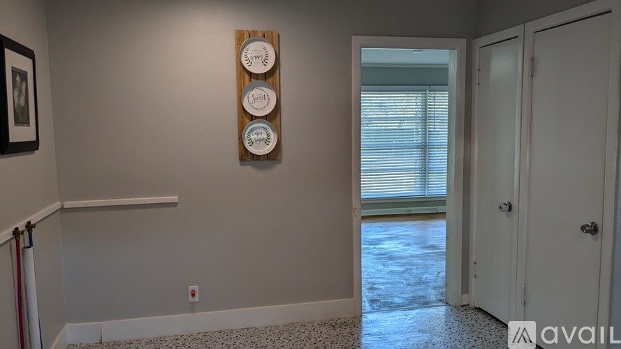 A wall with a clock and a picture on it.