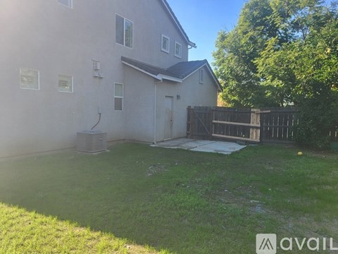 A house with a fence and a yard.