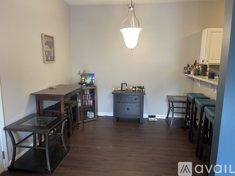 A living room with a grey couch and a coffee table.