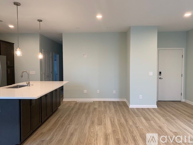 A kitchen with a sink and cabinets.