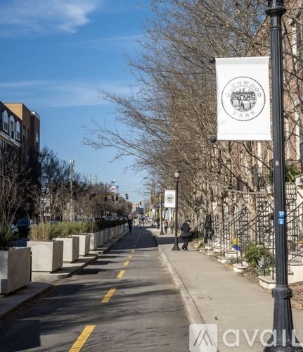 A street with a white sign that says "Temple Park".