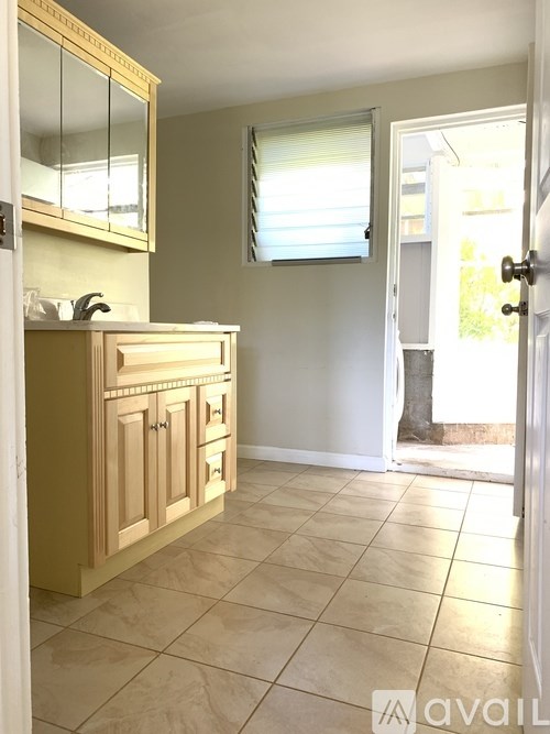 A bathroom with a sink and a mirror.