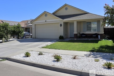 A house with a garage and a driveway.