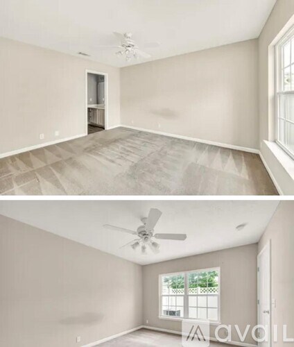 A room with a ceiling fan and a window.