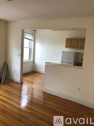 A room with wooden floors and white walls.