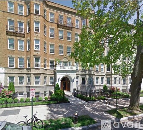 A building with a sign that says "Host 12th Floor" in front of it.