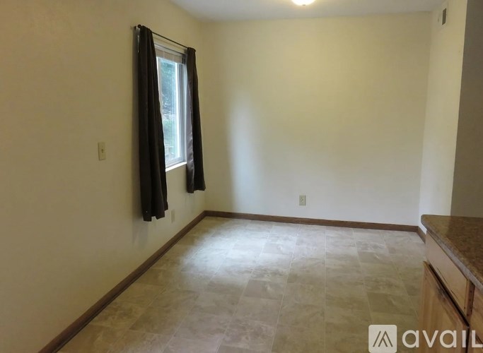 A room with a window and a counter.