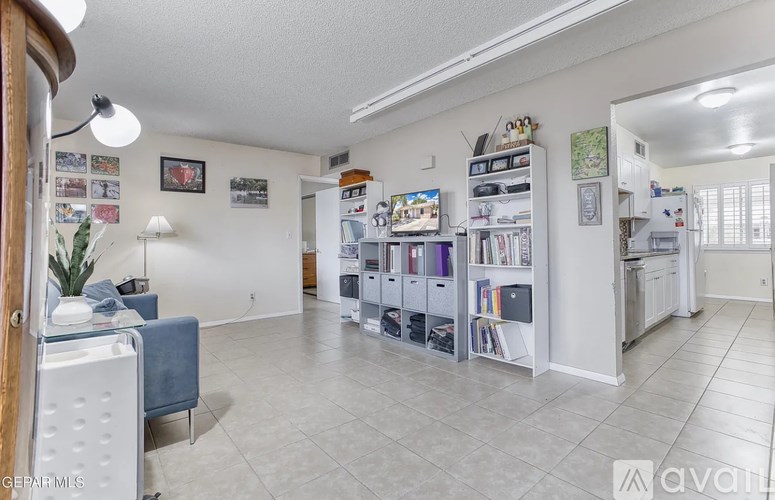 A kitchen with white appliances and a white fridge.