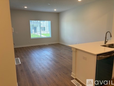 A kitchen with a sink and a window.