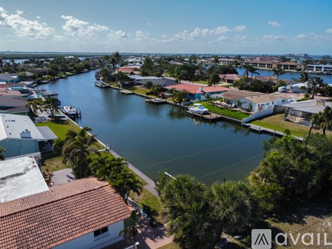 A view of a waterfront area with houses and boats.