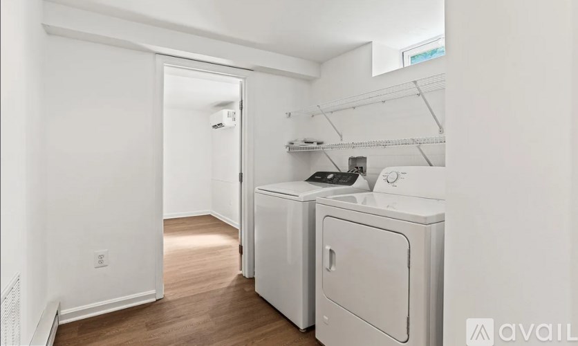 A laundry room with a washer and dryer.