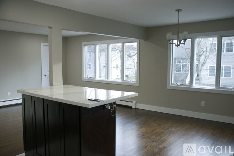 A kitchen with a counter and cabinets is available.
