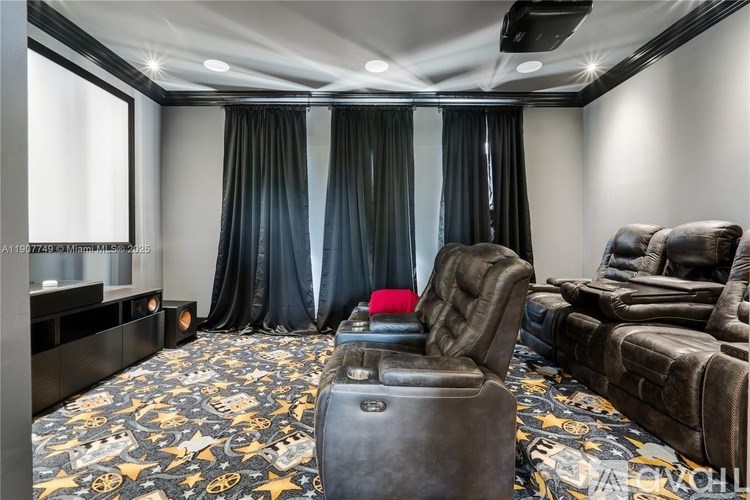 A room with a carpet that has a pattern of cars on it.