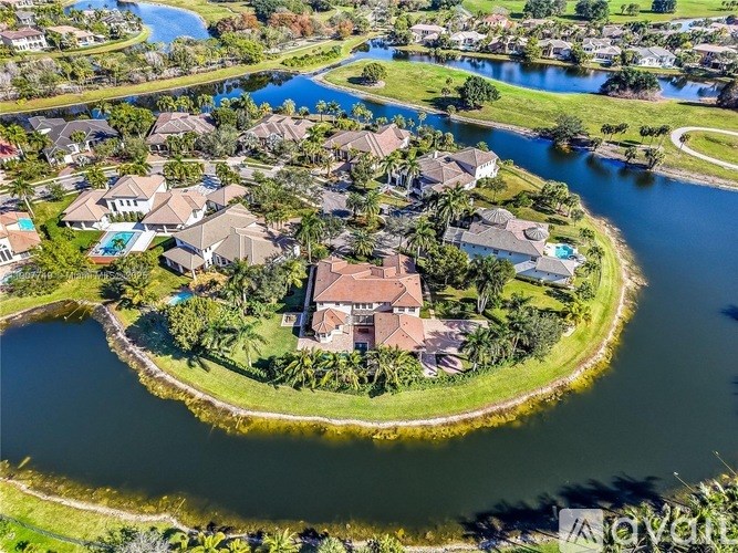 A bird's eye view of a residential area with houses and a river.