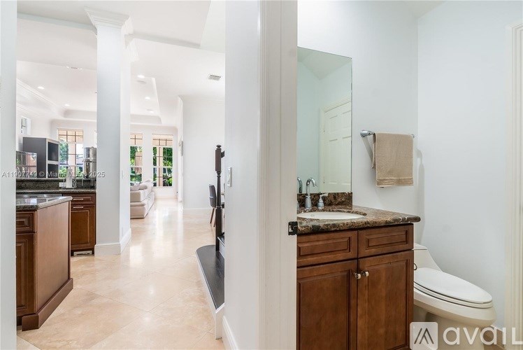 A bathroom with a towel hanging on the wall.