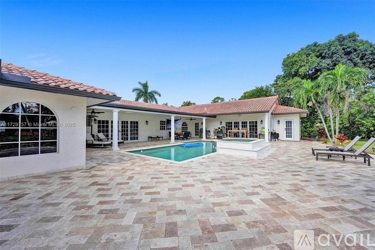 A house with a pool in the backyard.