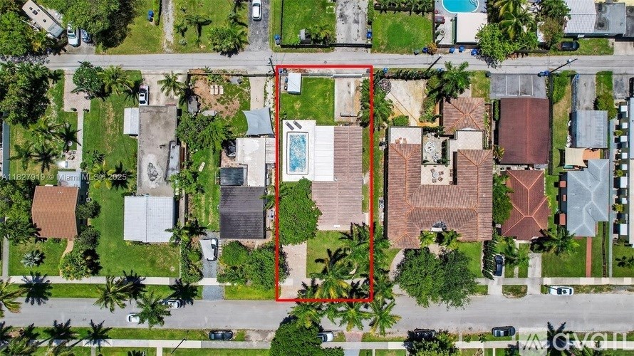 A red line is drawn on an aerial view of a neighborhood.