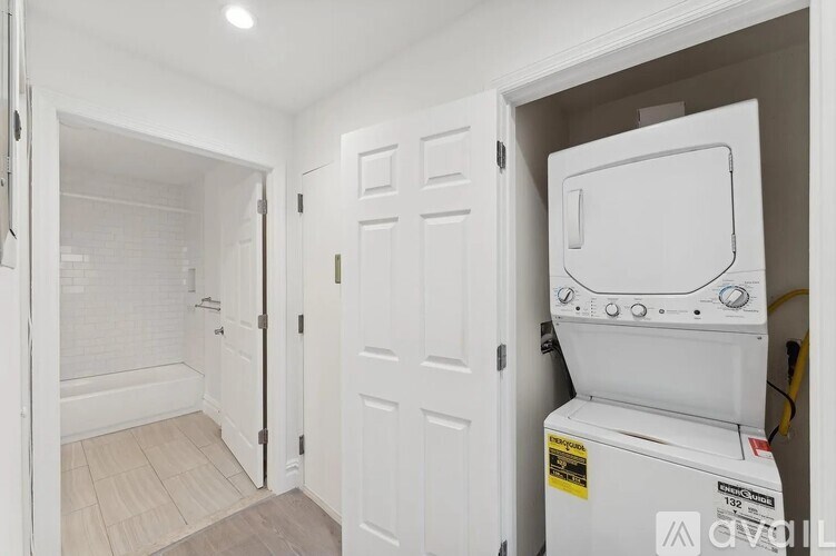 A white oven is in a small kitchen.