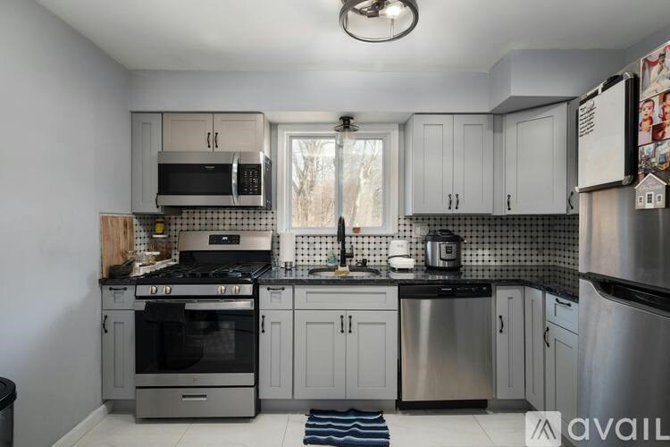 A kitchen with a stove, oven, and refrigerator.