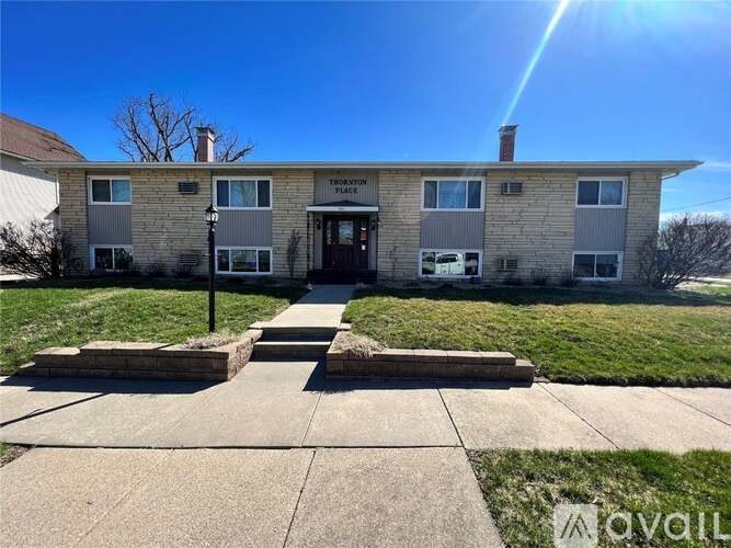 A building with a sign that says "Theater Place" on it.