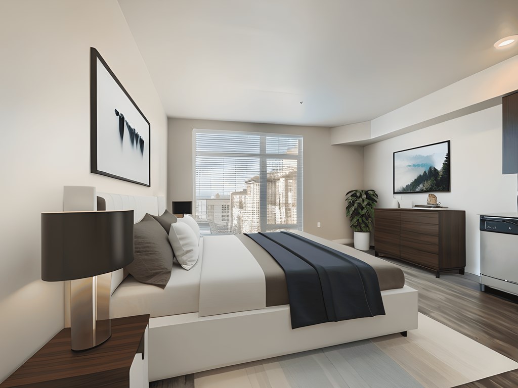 a white bedroom with a large bed and a window