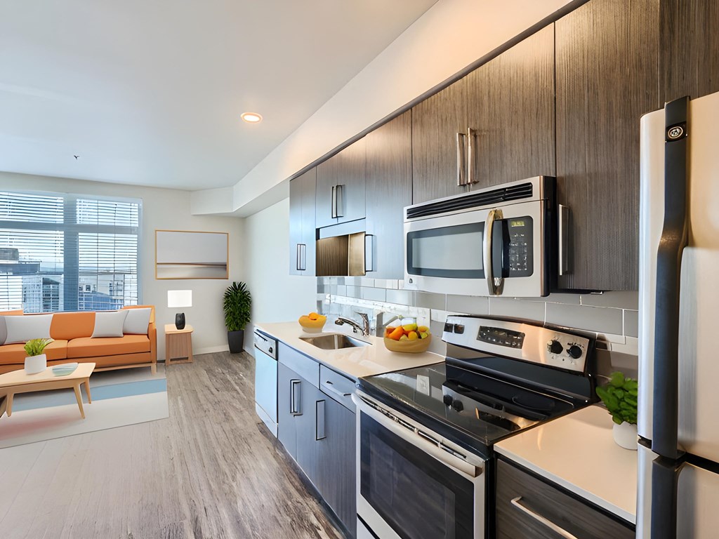 a kitchen with a stove refrigerator and microwave