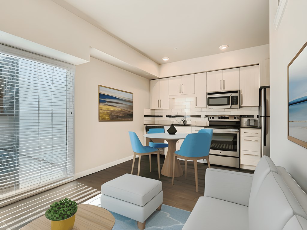 a living room with a couch and a table with chairs