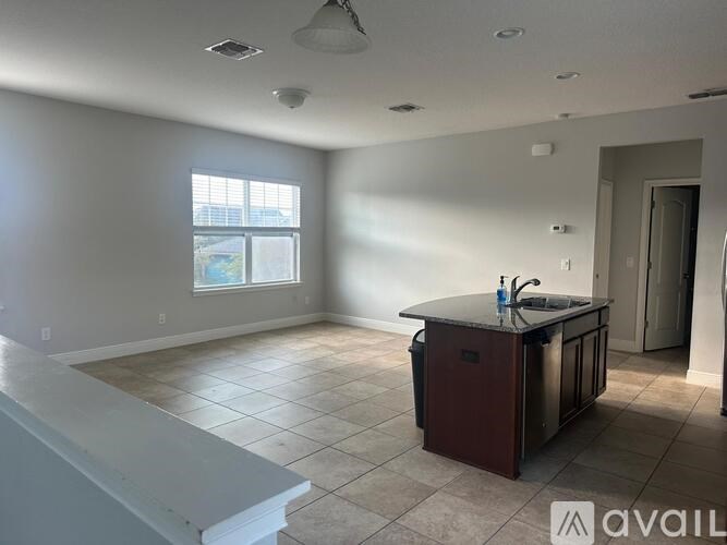 A kitchen area with a counter and a window.