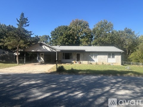 A house with a garage is for sale.