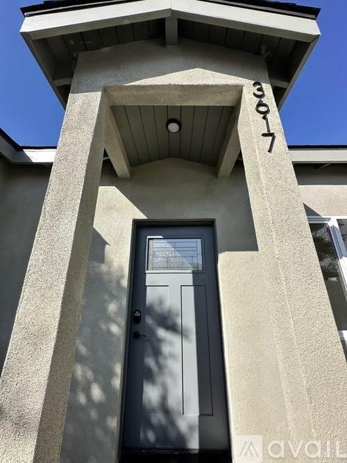 The number 3307 is on the top of a building.