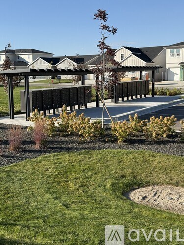 A residential area with houses and a well-maintained lawn.