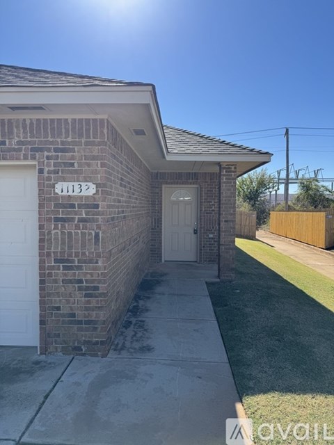 A house with the number 1132 on the front door.