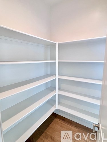A white shelving unit with multiple shelves.