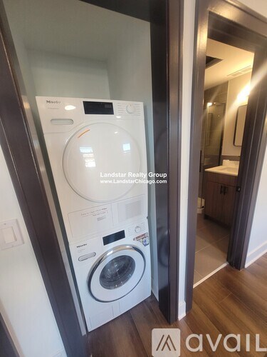 A washer and dryer in a Landstar Realty Group laundry room.