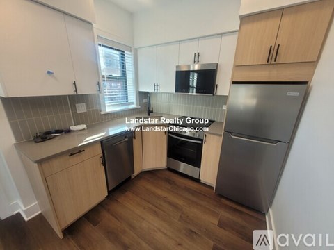 A kitchen with wooden cabinets and a stainless steel dishwasher.