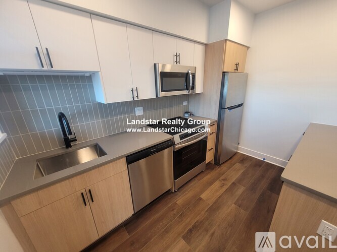 A kitchen with wooden cabinets and a stainless steel dishwasher.