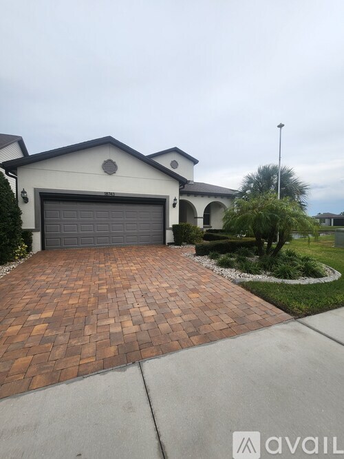 A house with a driveway in front of it.