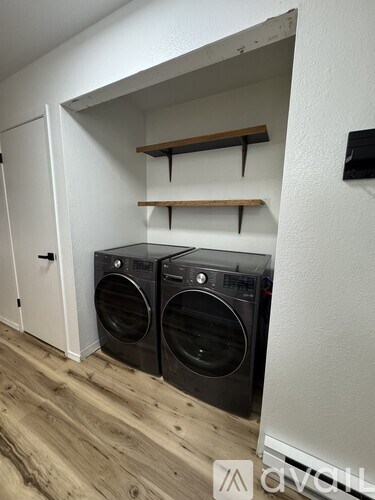 A laundry room with a washer and dryer.