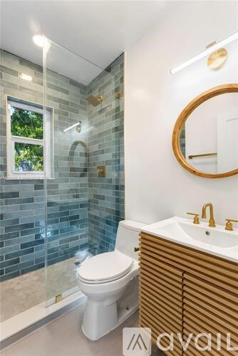 A white toilet sits next to a sink in a bathroom.