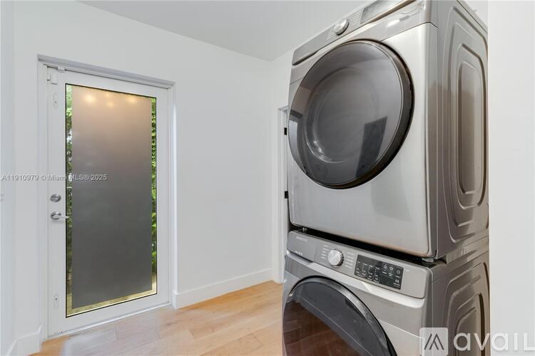 A stack of washing machines in a laundry room.