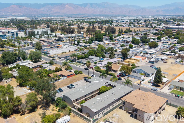 A large building with a parking lot in front of it.