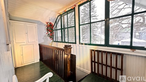 A room with a window and a door.