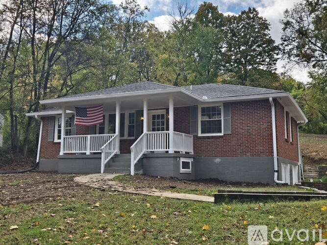 A house with a flag on the porch.